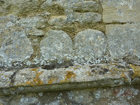 Columns from the praetorium laid horizontally and reused as part of the walls of the church